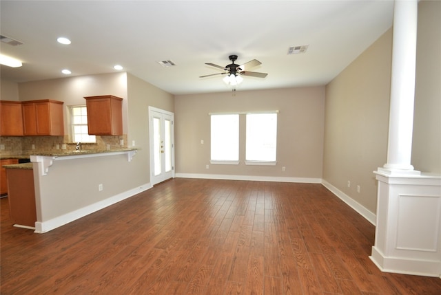 unfurnished living room with recessed lighting, a ceiling fan, ornate columns, and visible vents