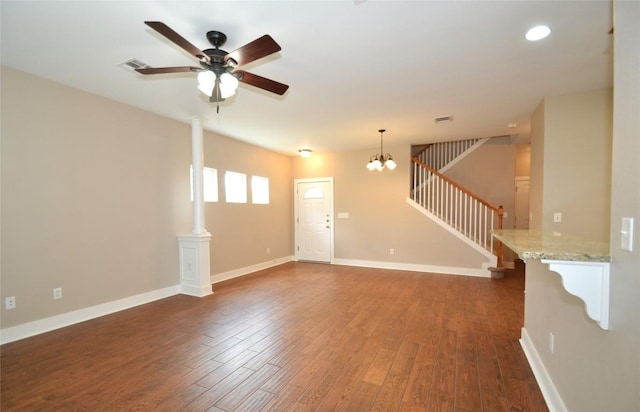 interior space with dark wood-style flooring, stairway, baseboards, ceiling fan with notable chandelier, and recessed lighting