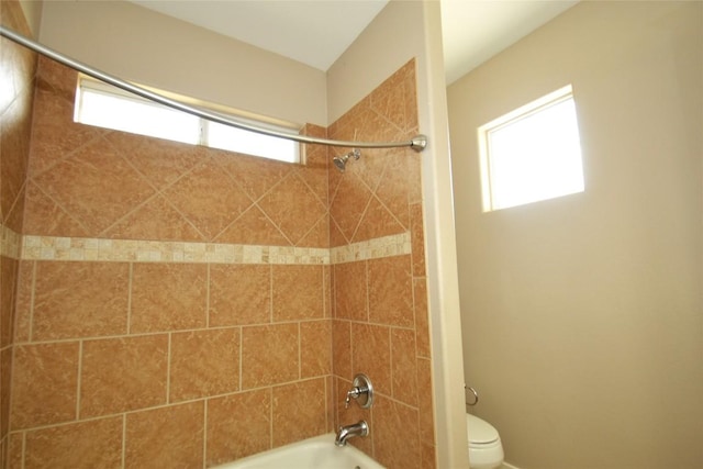 full bath with toilet, shower / bath combination, and plenty of natural light