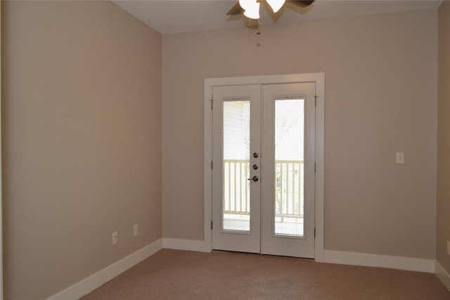doorway to outside featuring french doors, a ceiling fan, baseboards, and light carpet