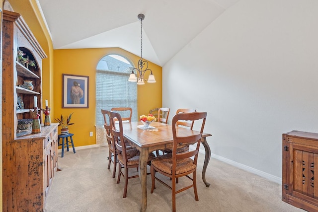 1720 Woodvista Pl, Round Rock, TX 78665 - dining space featuring light colored carpet, vaulted ceiling, a chandelier, and baseboards
