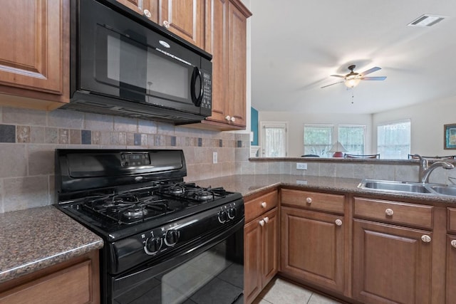 1720 Woodvista Pl, Round Rock, TX 78665 - kitchen featuring black appliances, a sink, brown cabinets, ceiling fan, and tasteful backsplash