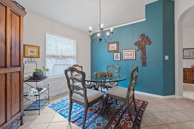 1720 Woodvista Pl, Round Rock, TX 78665 - dining area featuring arched walkways, light tile patterned floors, a chandelier, and baseboards