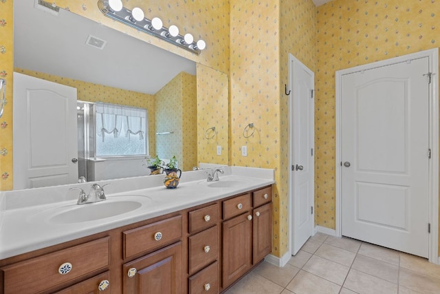 1720 Woodvista Pl, Round Rock, TX 78665 - bathroom featuring wallpapered walls, double vanity, tile patterned flooring, baseboards, and an enclosed shower