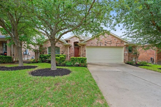 view of front of house featuring an attached garage, driveway, brick siding, and a front yard
