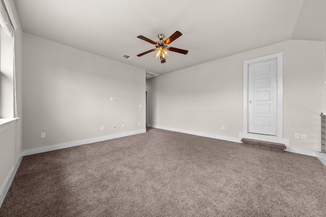 carpeted empty room featuring baseboards, ceiling fan, and visible vents