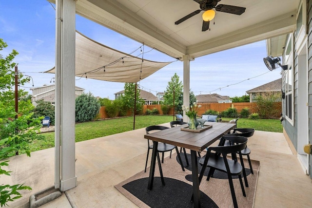 view of patio with a fenced backyard, outdoor dining space, and ceiling fan