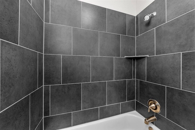 interior details with shower / bathing tub combination