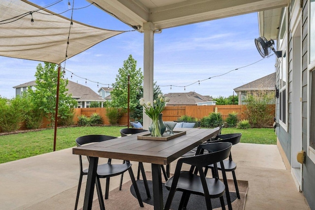 view of patio with a fenced backyard and outdoor dining space
