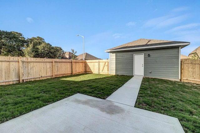 view of yard featuring a patio and a fenced backyard