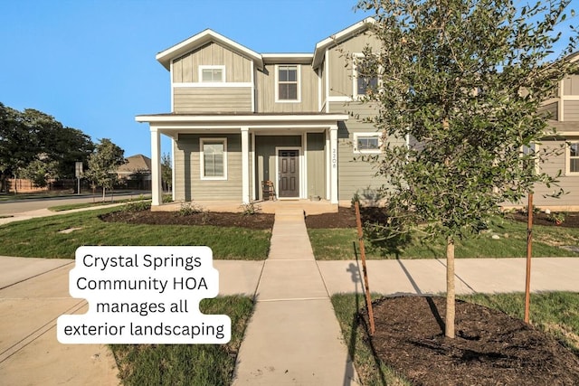 2208 Pecan Island Dr, Leander, TX 78641 - view of front facade featuring a porch and board and batten siding