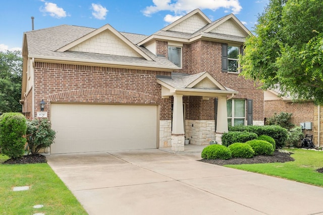 4018 Geary St, Round Rock, TX 78681 - view of front facade featuring brick siding, roof with shingles, concrete driveway, and stone siding
