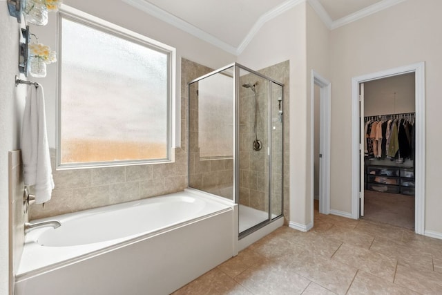 4018 Geary St, Round Rock, TX 78681 - bathroom featuring a garden tub, crown molding, a shower stall, a walk in closet, and baseboards