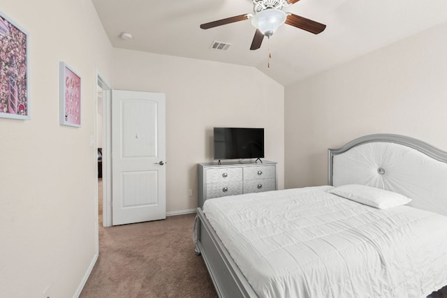 bedroom with carpet floors, visible vents, lofted ceiling, baseboards, and a ceiling fan