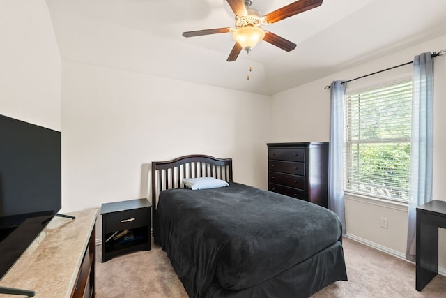 bedroom with baseboards, ceiling fan, lofted ceiling, and light colored carpet