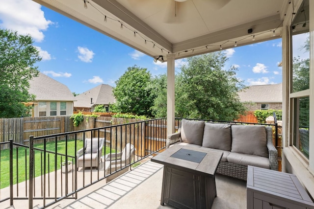 view of patio / terrace with a fenced backyard, a ceiling fan, and an outdoor hangout area