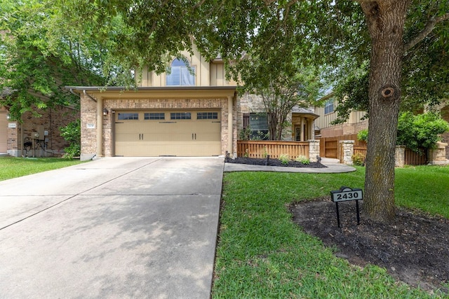 view of property hidden behind natural elements with fence, driveway, a front lawn, and brick siding