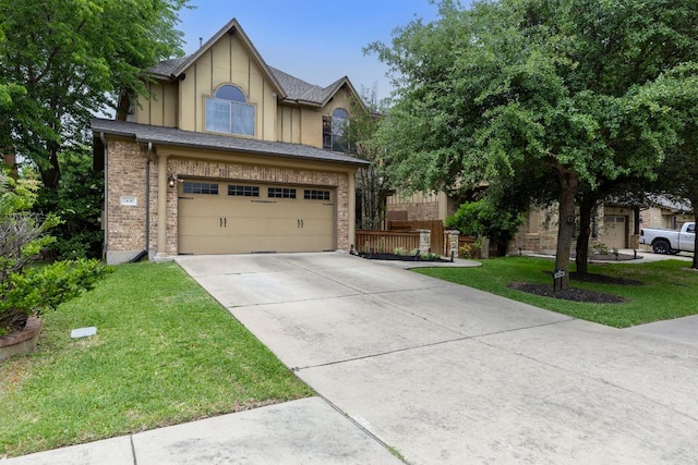 view of front of home with an attached garage, concrete driveway, brick siding, and a front yard