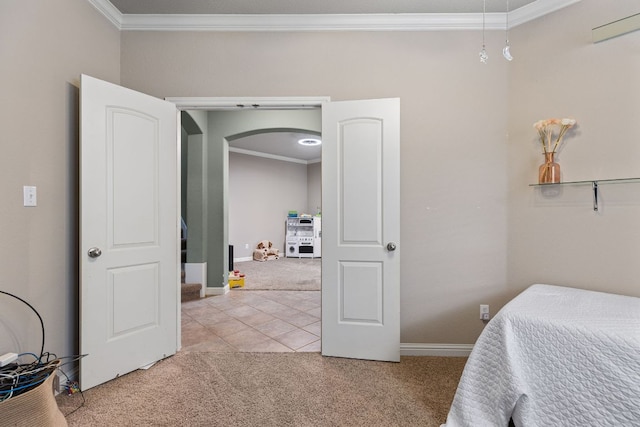bedroom with light colored carpet, baseboards, and crown molding