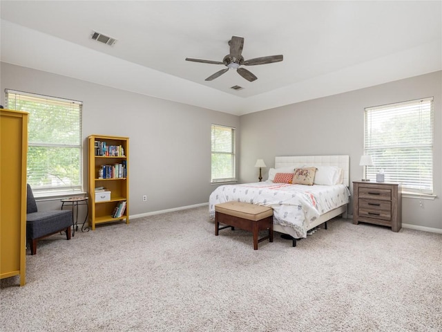 bedroom with carpet floors, baseboards, visible vents, and ceiling fan