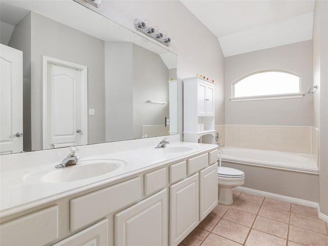 full bathroom with a sink, tile patterned flooring, a garden tub, and double vanity
