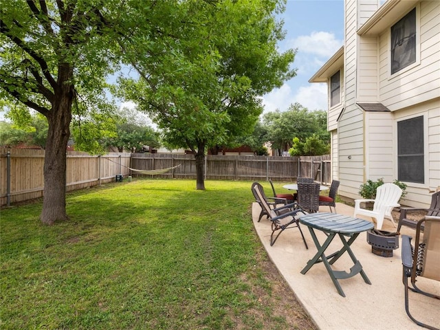 view of yard with a fenced backyard and a patio
