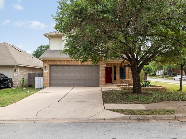 obstructed view of property featuring a garage, driveway, and brick siding