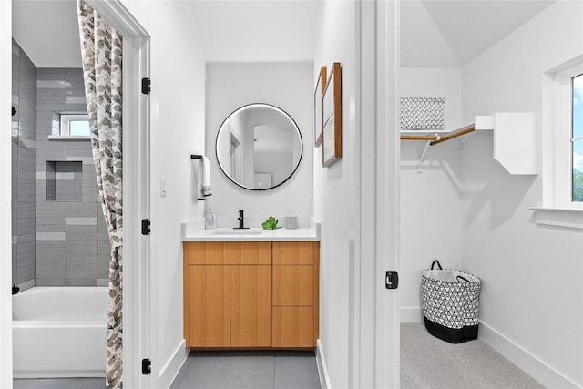 full bath with baseboards, shower / tub combo with curtain, and vanity