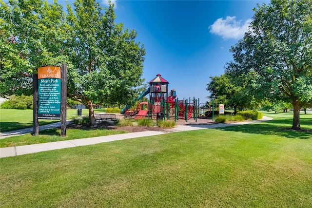 community jungle gym with a yard