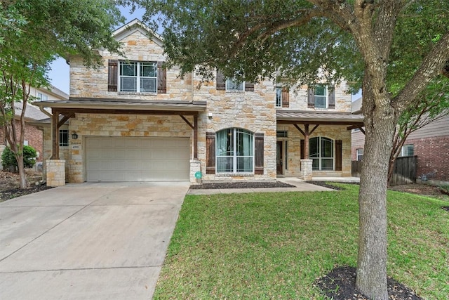 view of front of property with stone siding, a garage, a front yard, and driveway