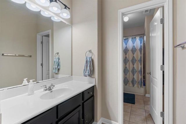 bathroom featuring vanity, tile patterned flooring, a shower with curtain, and baseboards