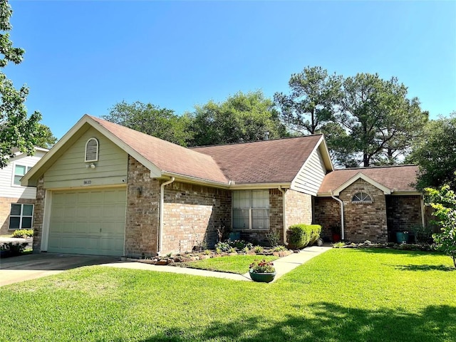 ranch-style home with a garage, a front yard, brick siding, a shingled roof, and driveway
