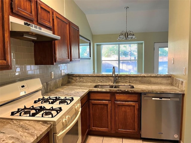 kitchen with under cabinet range hood, stainless steel dishwasher, a sink, lofted ceiling, and white range with gas stovetop