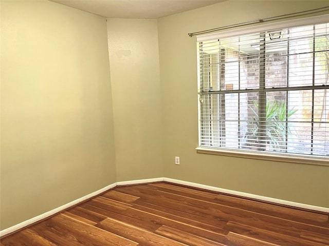 8610 Pine Falls Dr, Houston, TX 77095 - spare room with baseboards, plenty of natural light, and wood finished floors