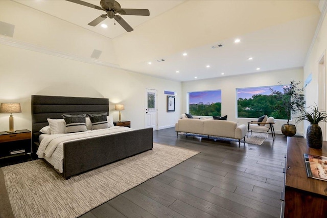 bedroom with recessed lighting, multiple windows, and dark wood finished floors
