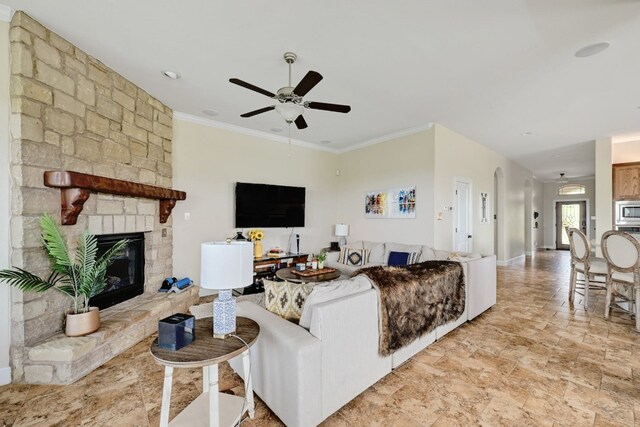 18720 Waltz Ct, Austin, TX 78738 - living area with a ceiling fan, a stone fireplace, and crown molding