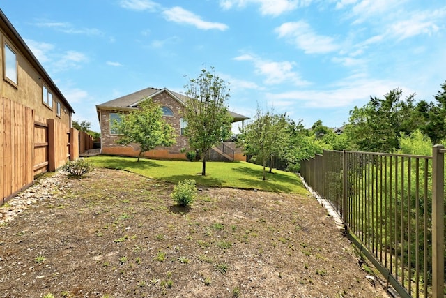view of yard with a fenced backyard