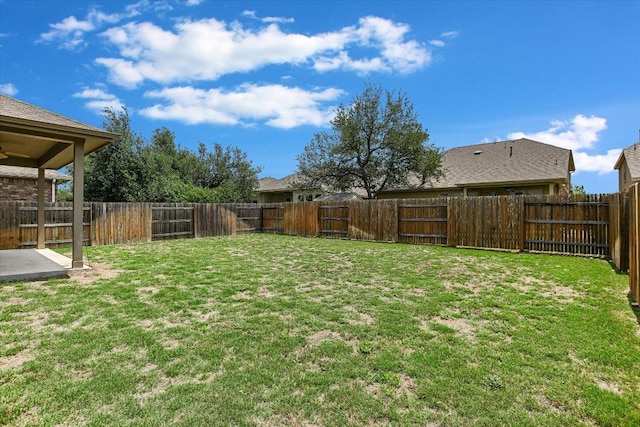 view of yard with a fenced backyard