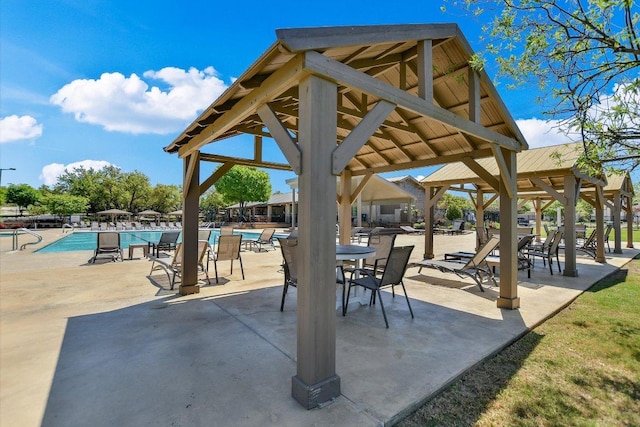 exterior space with a community pool and a gazebo