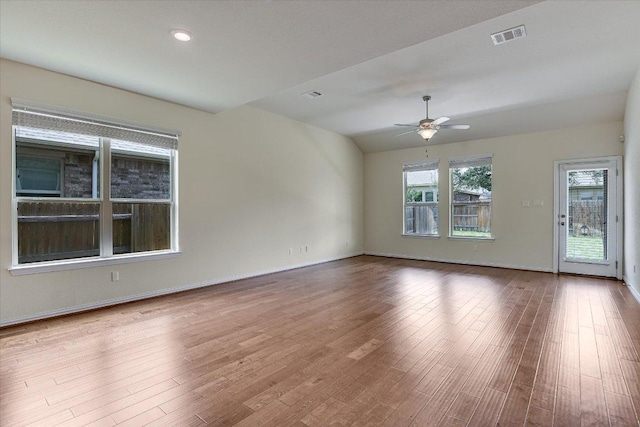 unfurnished room featuring visible vents, ceiling fan, and wood finished floors