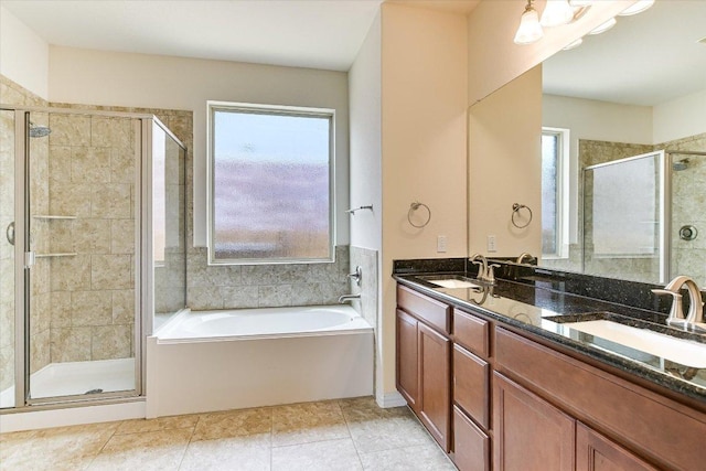 bathroom with plenty of natural light, a sink, and a shower stall