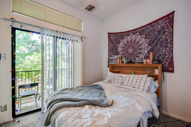 bedroom with carpet flooring, visible vents, and access to exterior