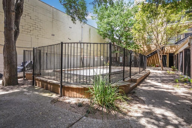 view of gate featuring fence