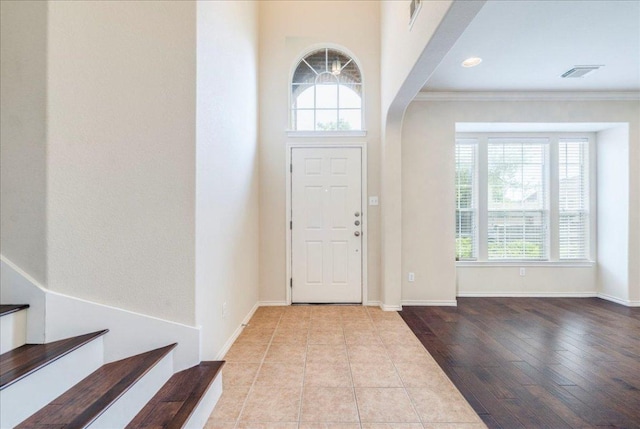 3012 Centennial Olympic Park, Austin, TX 78732 - entryway featuring healthy amount of natural light, ornamental molding, baseboards, and wood finished floors