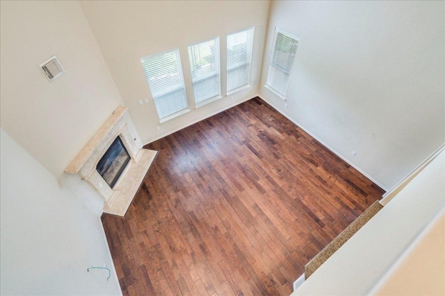 3012 Centennial Olympic Park, Austin, TX 78732 - unfurnished living room with a high end fireplace and dark wood-style flooring