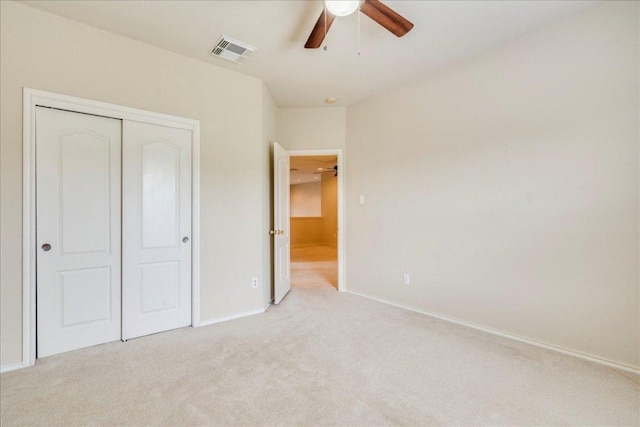 3012 Centennial Olympic Park, Austin, TX 78732 - unfurnished bedroom with light colored carpet, baseboards, a closet, and ceiling fan