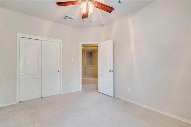 3012 Centennial Olympic Park, Austin, TX 78732 - unfurnished bedroom featuring carpet, a closet, baseboards, and a ceiling fan