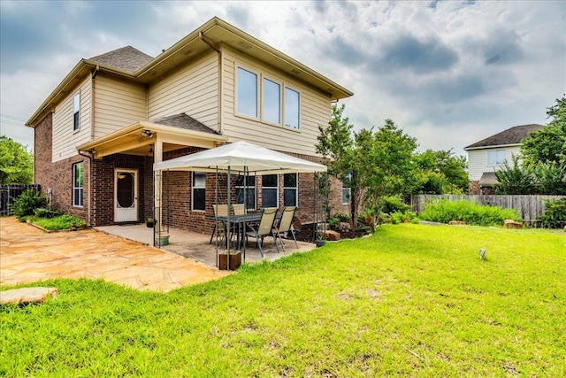 3012 Centennial Olympic Park, Austin, TX 78732 - rear view of property with brick siding and a patio