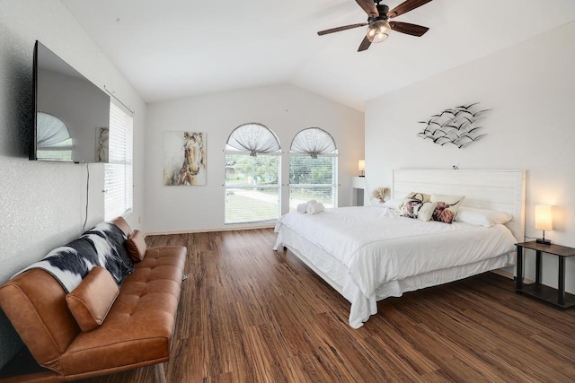 bedroom featuring multiple windows, a ceiling fan, wood finished floors, and lofted ceiling
