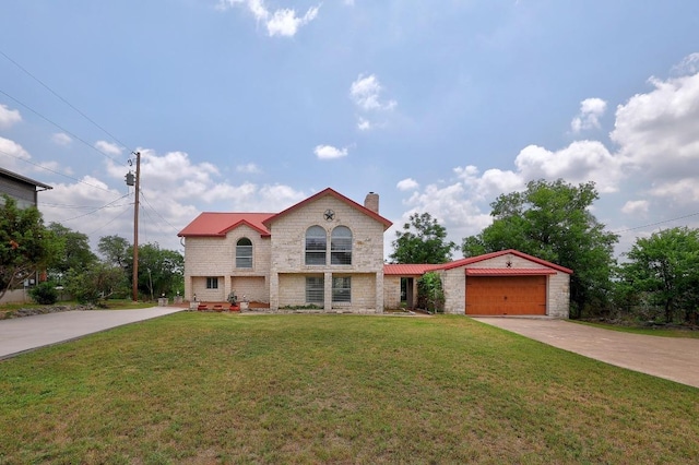 mediterranean / spanish home featuring a garage, a front yard, stone siding, a chimney, and driveway